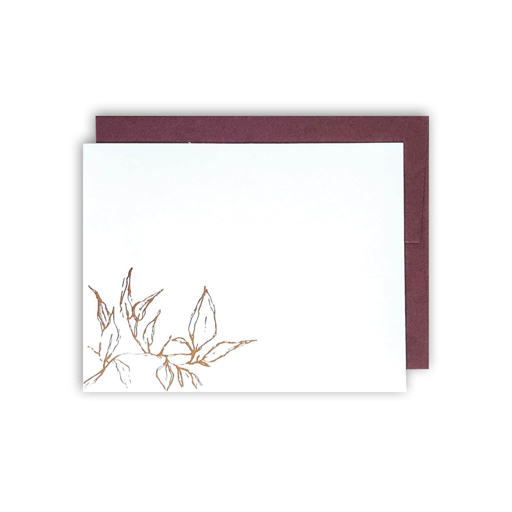Gold foil stamped blank notecard leaves white